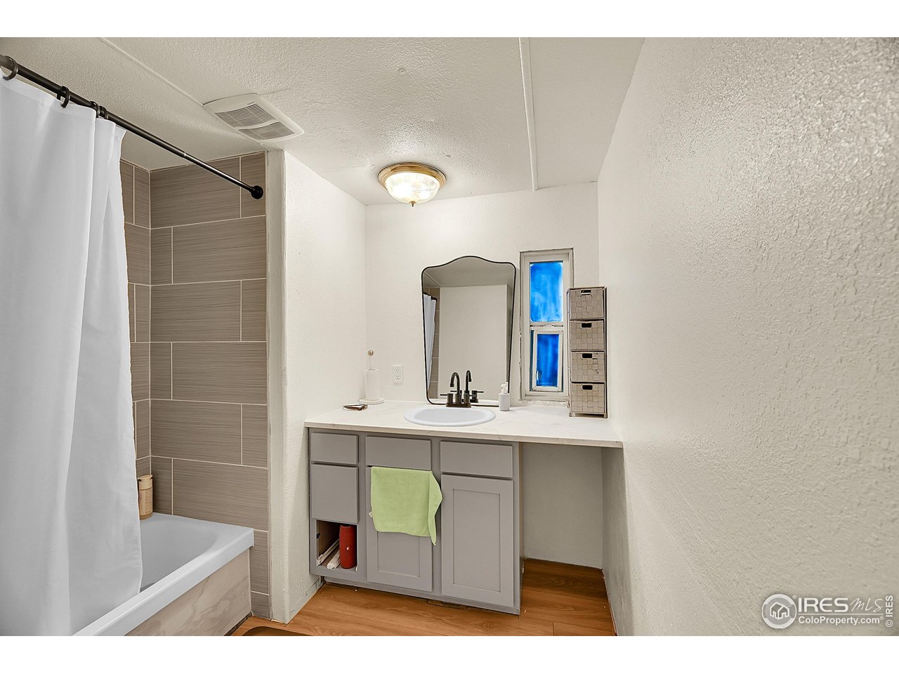 2500 East Harmony Road, Unit 178 Fort Collins, CO 80528 - Photo 11 of 22 a bathroom with a sink mirror and shower