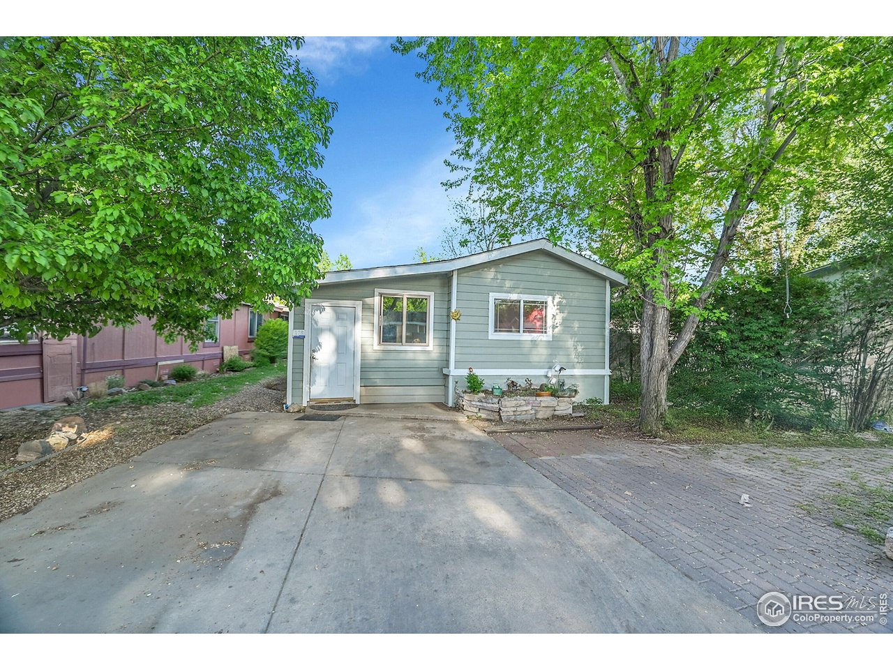 2500 East Harmony Road, Unit 178 Fort Collins, CO 80528 - Photo 15 of 22 a view of a house with a yard and potted plants