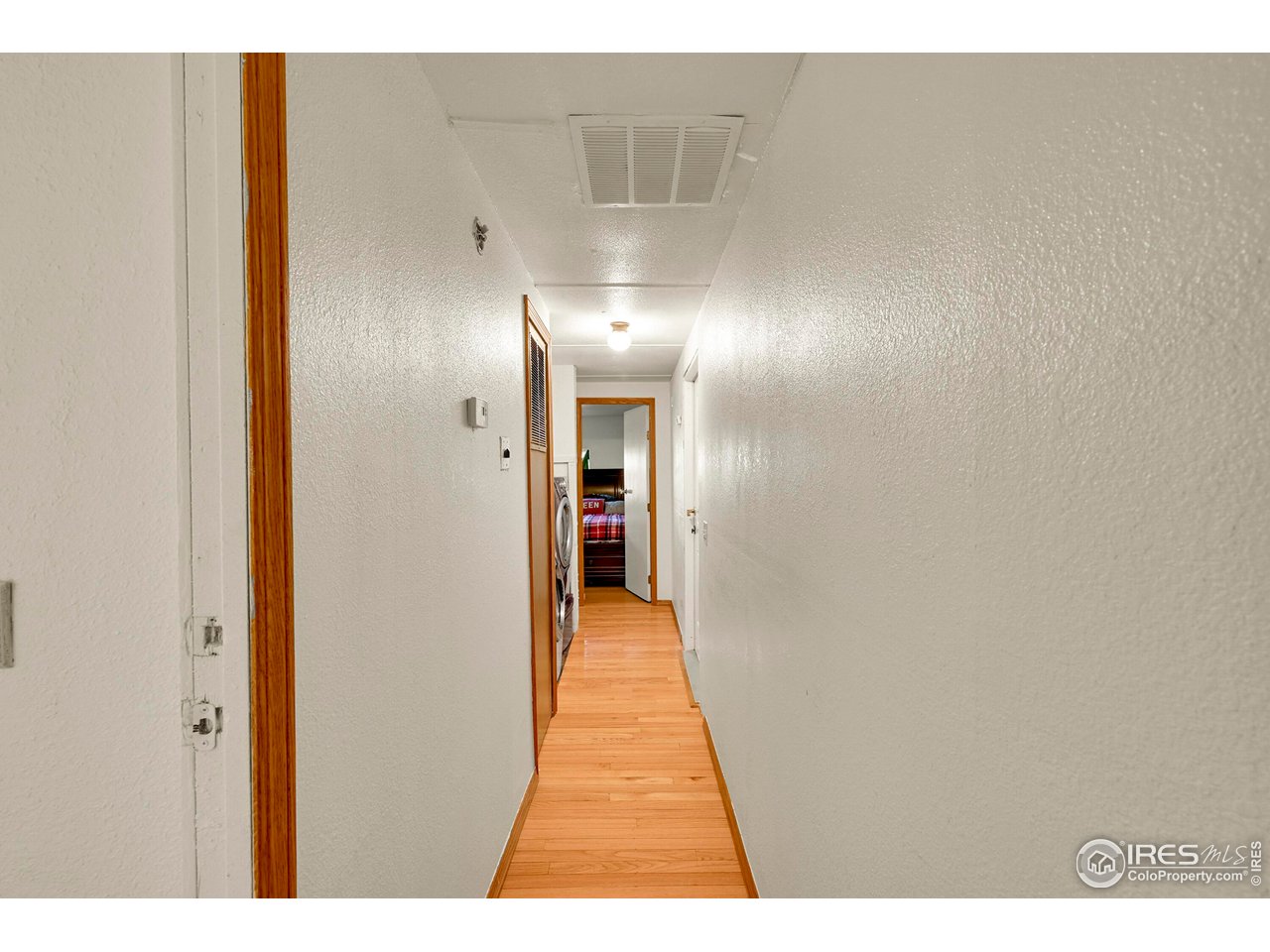 2500 East Harmony Road, Unit 178 Fort Collins, CO 80528 - Photo 18 of 22 a view of a hallway with wooden floor