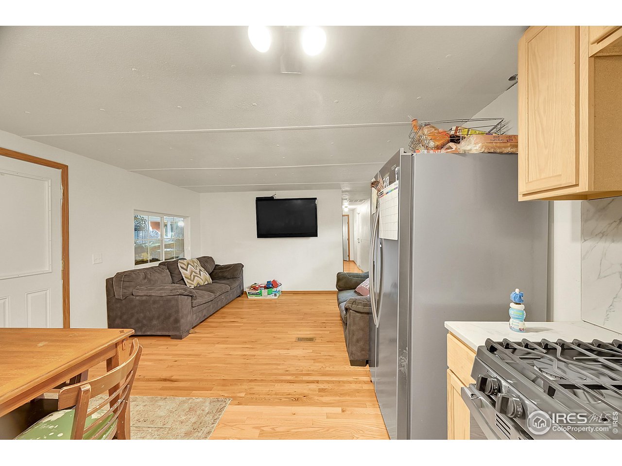 2500 East Harmony Road, Unit 178 Fort Collins, CO 80528 - Photo 3 of 22 a bedroom with a bed and a flat screen tv