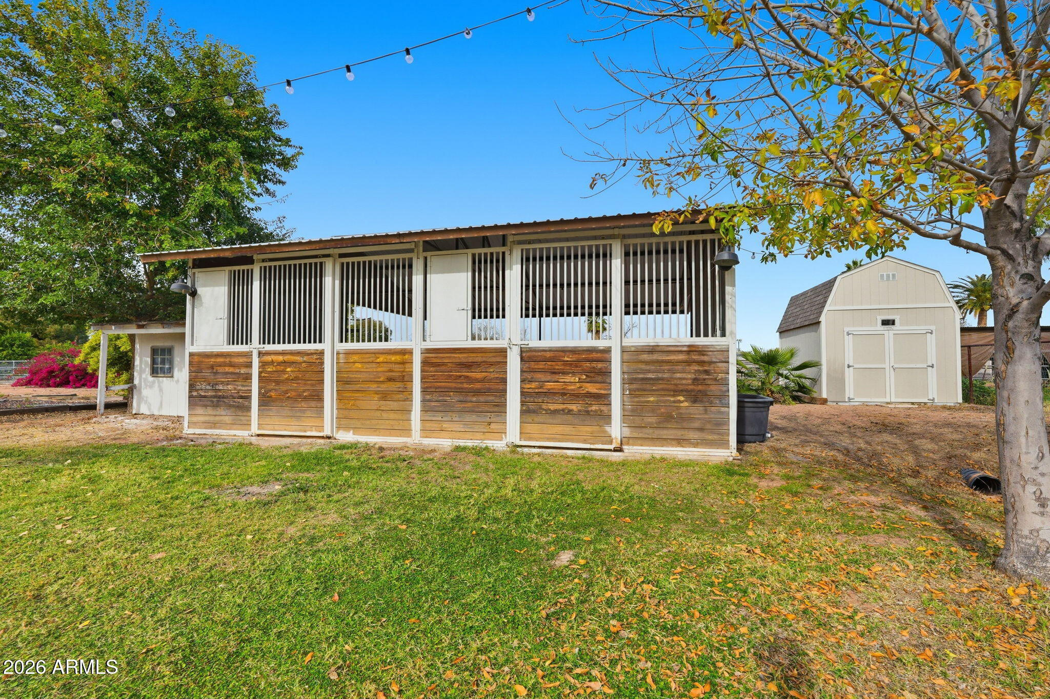 2858 East Redfield Road Gilbert, AZ 85234 - Photo 50 of 60 a view of a house with a yard and garage