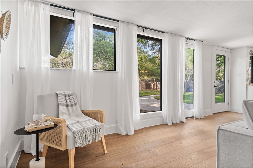 3402 Saddlestring Trail Austin, TX 78739 - Photo 15 of 33 Doorway featuring wood finished floors and plenty of natural light