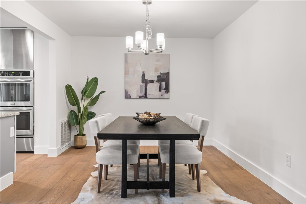 3402 Saddlestring Trail Austin, TX 78739 - Photo 18 of 33 Dining space with light wood-style flooring and suspended lighting