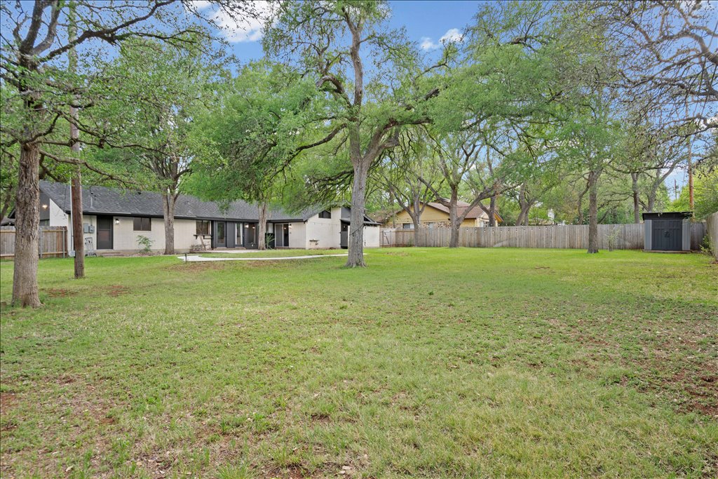 3402 Saddlestring Trail Austin, TX 78739 - Photo 19 of 33 Fenced yard featuring a storage shed