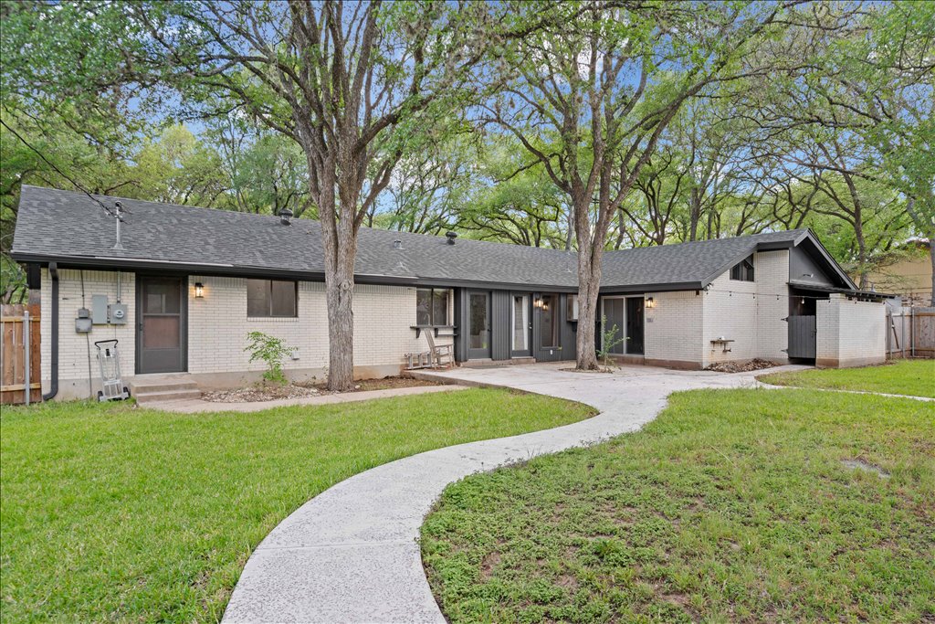 3402 Saddlestring Trail Austin, TX 78739 - Photo 20 of 33 View of front of home featuring brick siding and a shingled roof