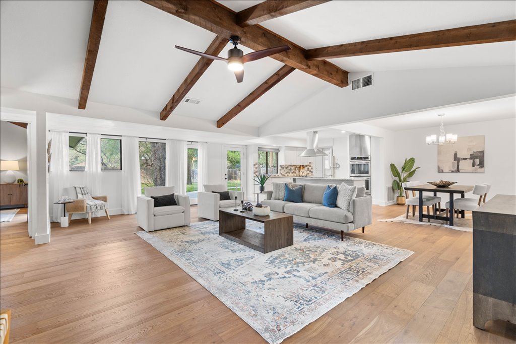 3402 Saddlestring Trail Austin, TX 78739 - Photo 2 of 33 Living room with ceiling fan, light wood finished floors, and suspended lighting