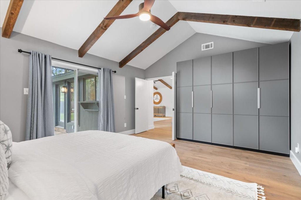 3402 Saddlestring Trail Austin, TX 78739 - Photo 22 of 33 Bedroom with light wood-style flooring, a ceiling fan, and access to exterior