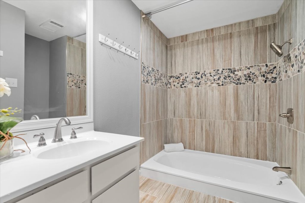 3402 Saddlestring Trail Austin, TX 78739 - Photo 25 of 33 Bathroom with shower / tub combination and vanity