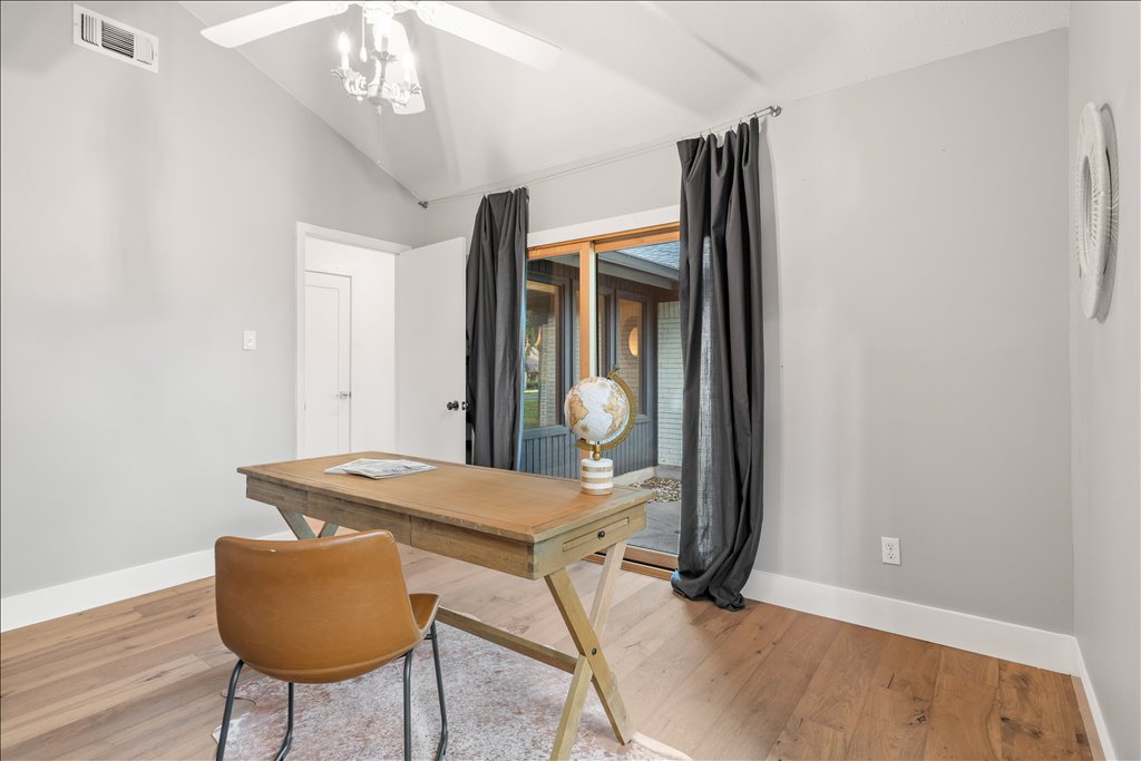 3402 Saddlestring Trail Austin, TX 78739 - Photo 27 of 33 Home office featuring ceiling fan, wood finished floors, and lofted ceiling