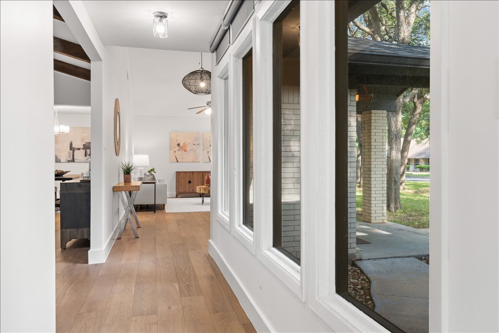 3402 Saddlestring Trail Austin, TX 78739 - Photo 28 of 33 Hall featuring light wood-type flooring and baseboards