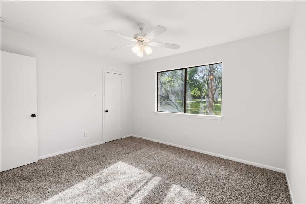 3402 Saddlestring Trail Austin, TX 78739 - Photo 31 of 33 Unfurnished bedroom with carpet flooring and a ceiling fan
