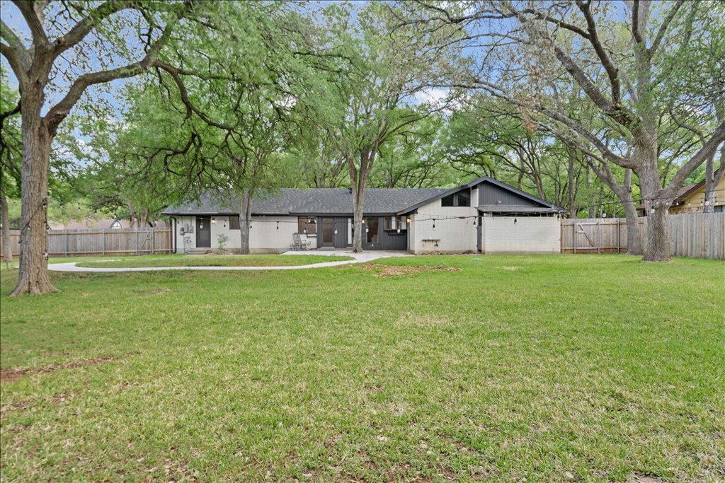 3402 Saddlestring Trail Austin, TX 78739 - Photo 32 of 33 Rear view of house featuring a fenced backyard
