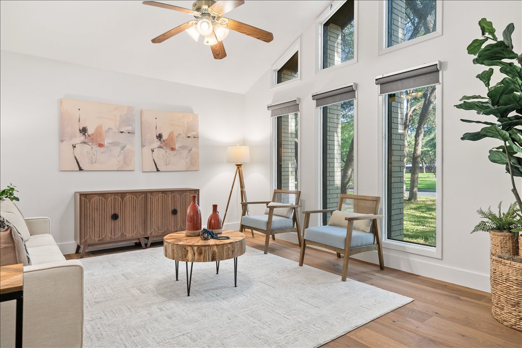 3402 Saddlestring Trail Austin, TX 78739 - Photo 8 of 33 Living area featuring a ceiling fan, lofted ceiling, and wood finished floors
