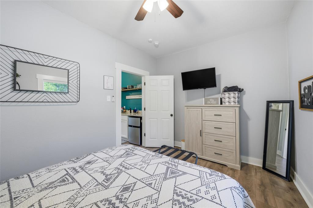 2320 Mistletoe Street Waco, TX 76706 - Photo 18 of 23 a bedroom with a bed and a flat screen tv