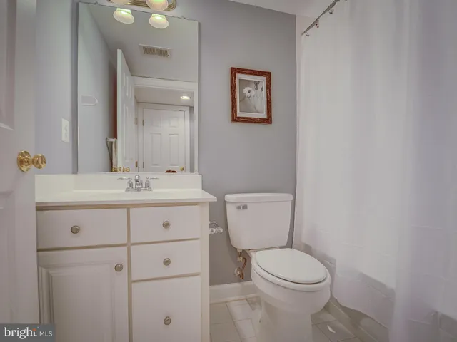 a bathroom with a sink a toilet and bathtub