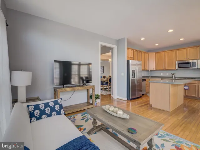 a kitchen with stainless steel appliances granite countertop a stove a microwave and cabinets