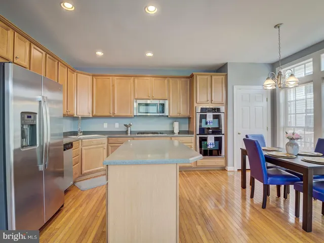 a dining room with furniture window wooden floor