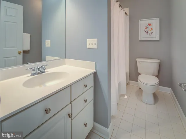 a bathroom with a sink toilet