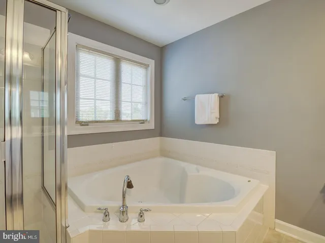 a en suite bathroom with a sink and mirror
