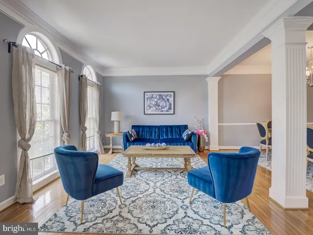 a bathroom with a toilet a sink a mirror and vanity