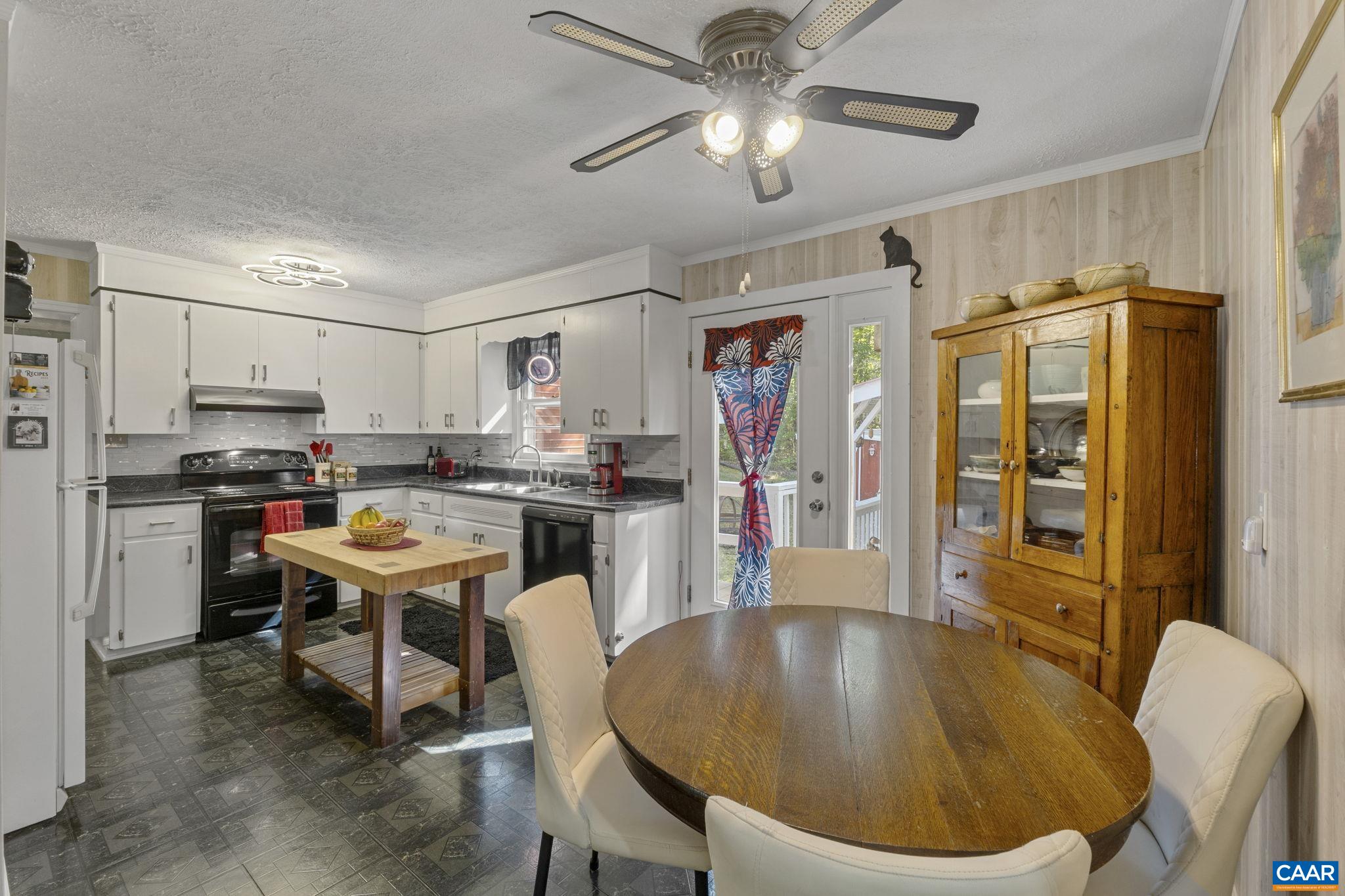 9020 West River Road Palmyra, VA 22963 - Photo 12 of 41 a living room with stainless steel appliances kitchen island granite countertop furniture and a refrigerator