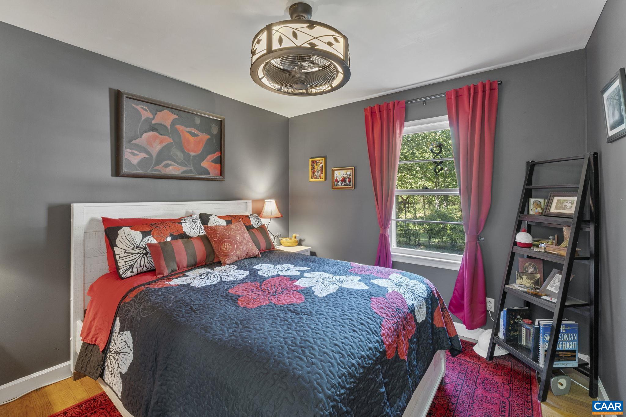 9020 West River Road Palmyra, VA 22963 - Photo 13 of 41 a bedroom with a bed and a painting on the wall