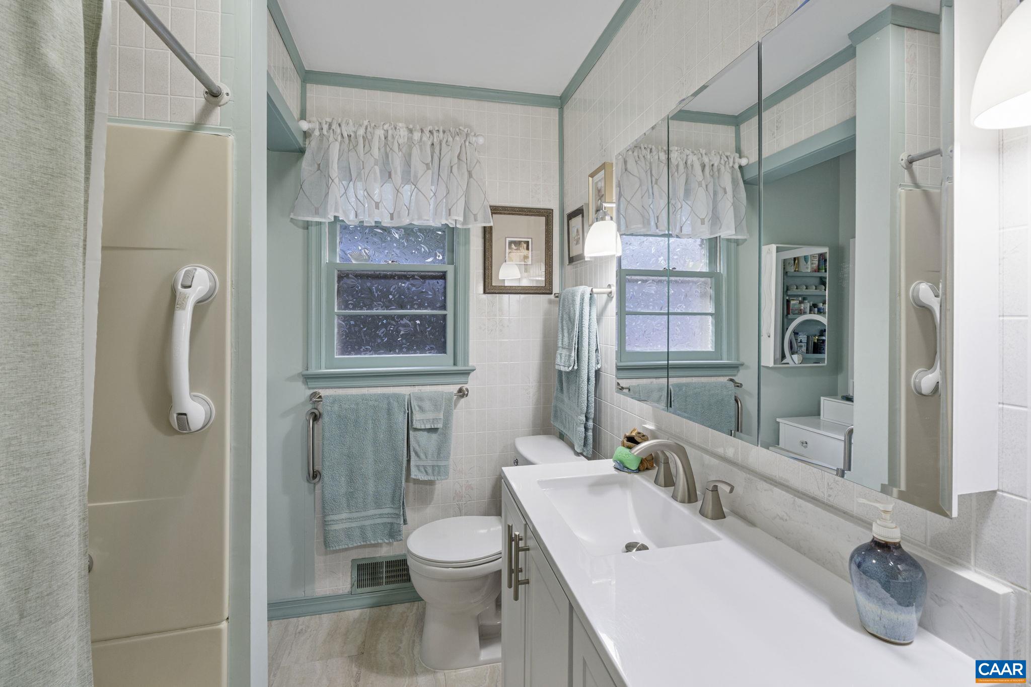 9020 West River Road Palmyra, VA 22963 - Photo 14 of 41 a bathroom with a sink a toilet and shower