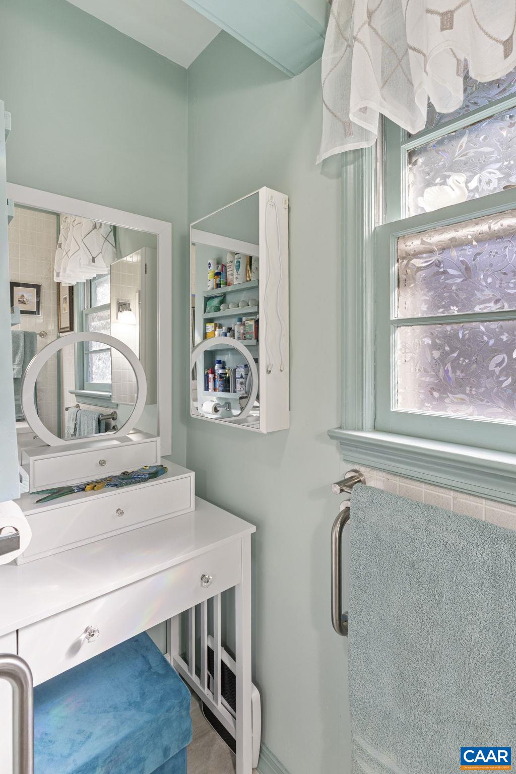 9020 West River Road Palmyra, VA 22963 - Photo 15 of 41 a bathroom with a sink a mirror and a window