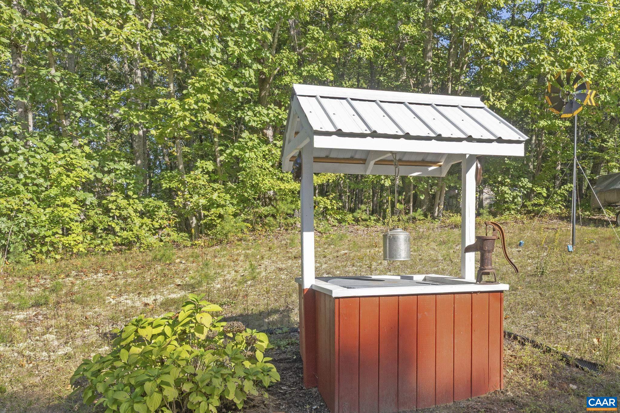 9020 West River Road Palmyra, VA 22963 - Photo 34 of 41 a view of a two chairs in the patio with a yard