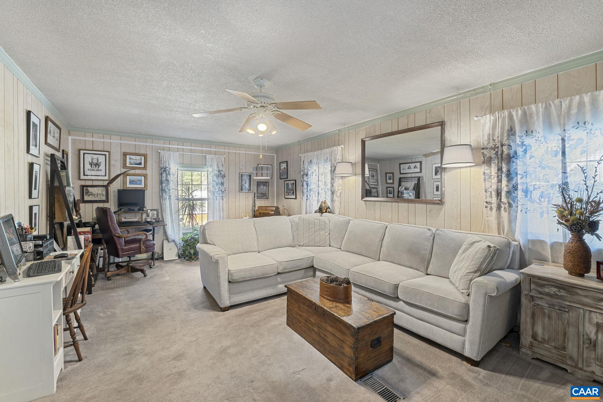 9020 West River Road Palmyra, VA 22963 - Photo 6 of 41 a living room with furniture and a large window