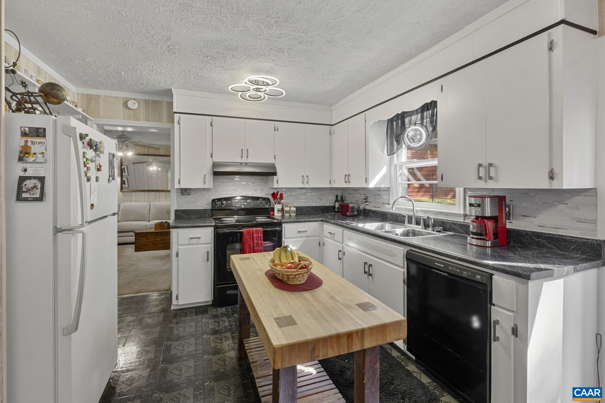 9020 West River Road Palmyra, VA 22963 - Photo 9 of 41 a kitchen with stainless steel appliances granite countertop a refrigerator sink stove microwave and cabinets