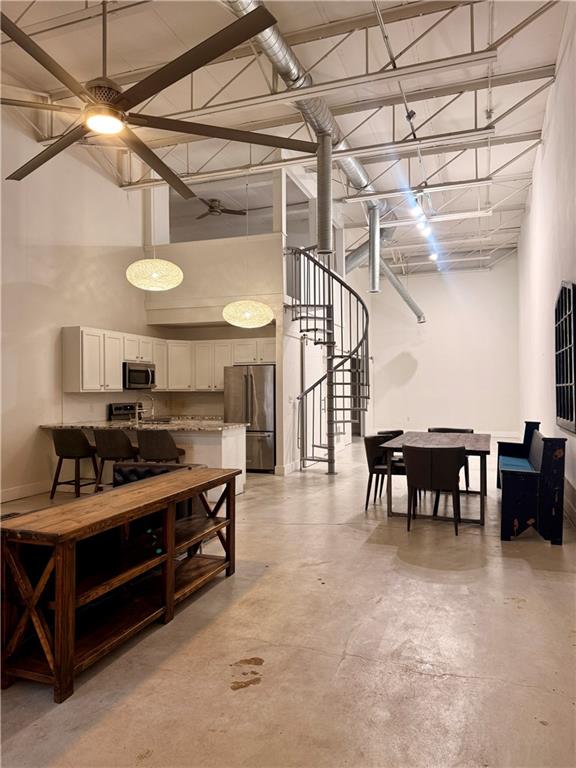a view of a room with chairs and a table
