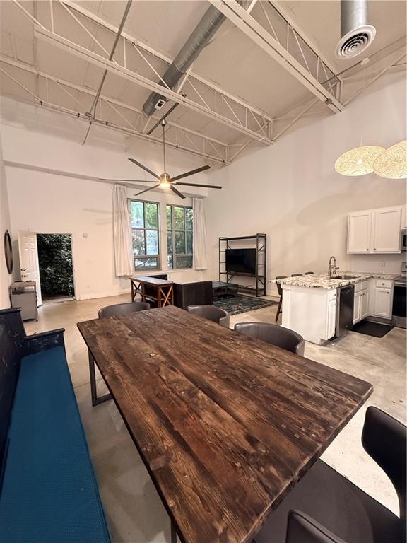 807 Field Street Southeast Atlanta, GA 30316 - Photo 2 of 8 a room with kitchen island stainless steel appliances wooden floor and windows