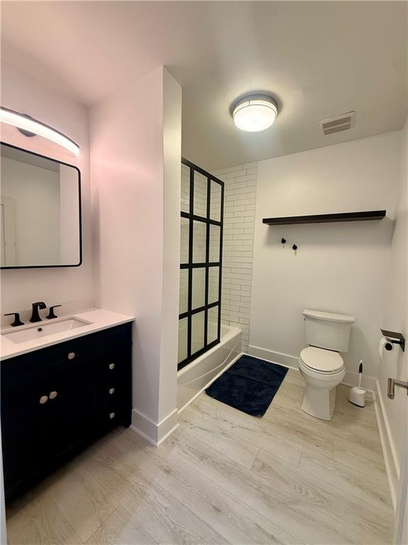 807 Field Street Southeast Atlanta, GA 30316 - Photo 5 of 8 a bathroom with a sink toilet and mirror