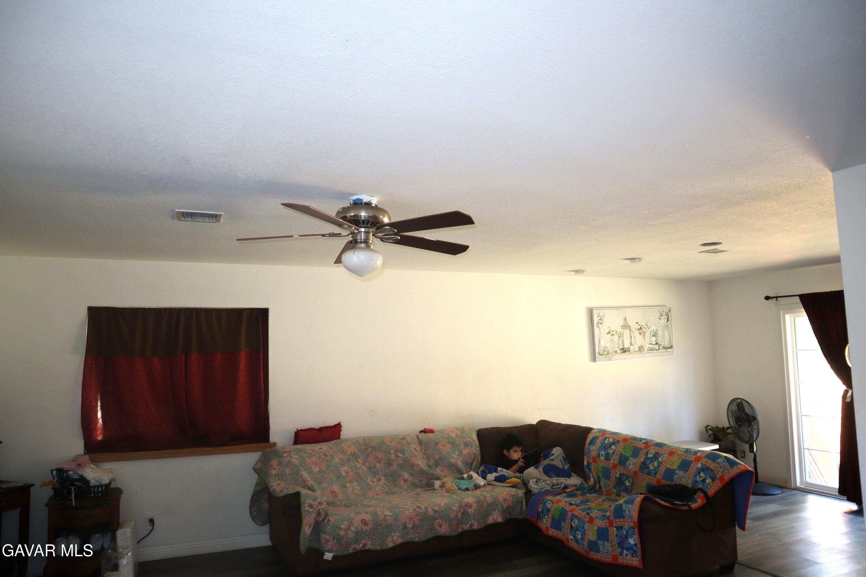 14955 Elizabeth Lake Road Lake Hughes, CA 93532 - Photo 14 of 17 a living room with furniture and a window