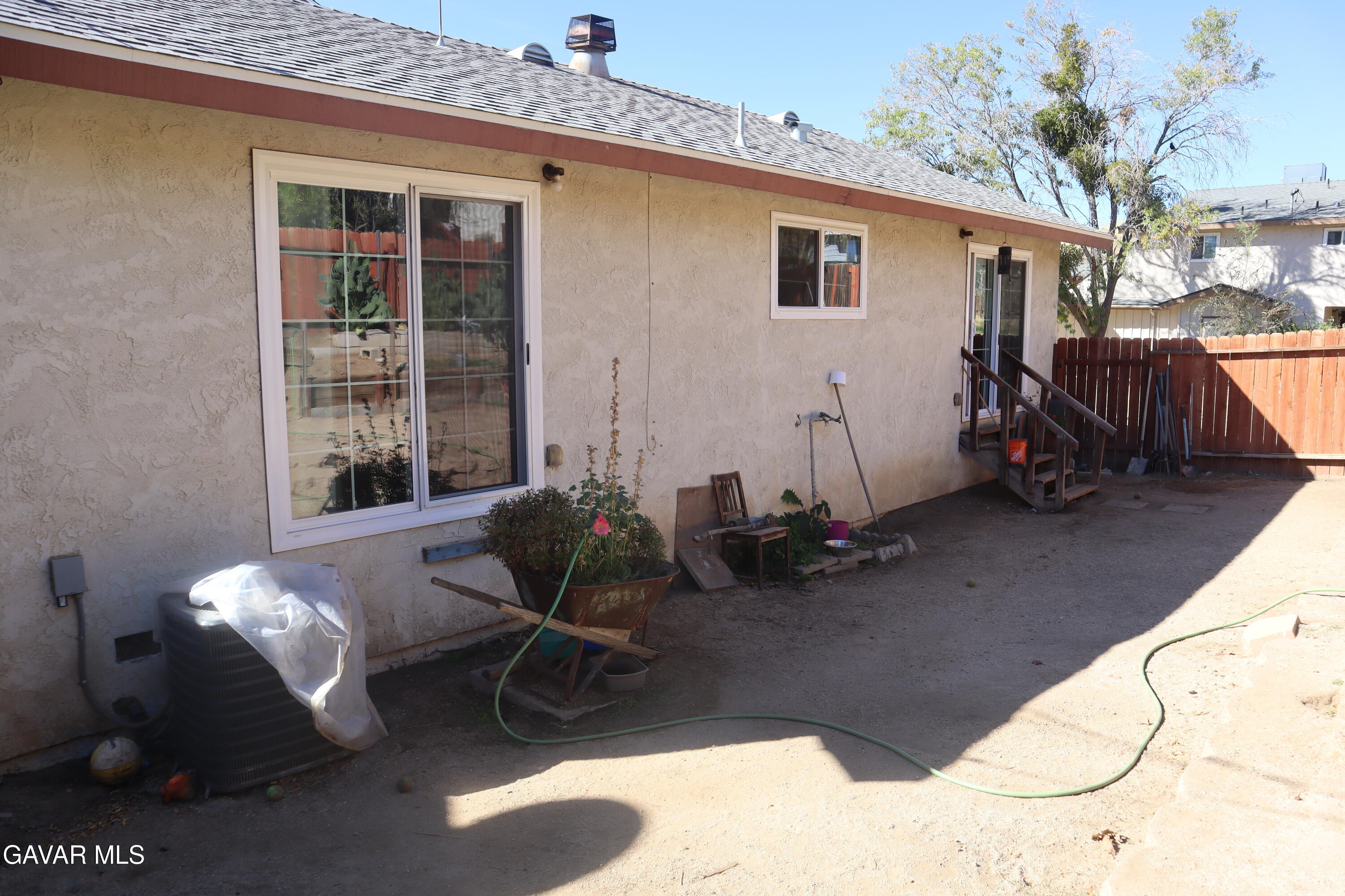 14955 Elizabeth Lake Road Lake Hughes, CA 93532 - Photo 17 of 17 a view of a patio with table and chairs and potted plants