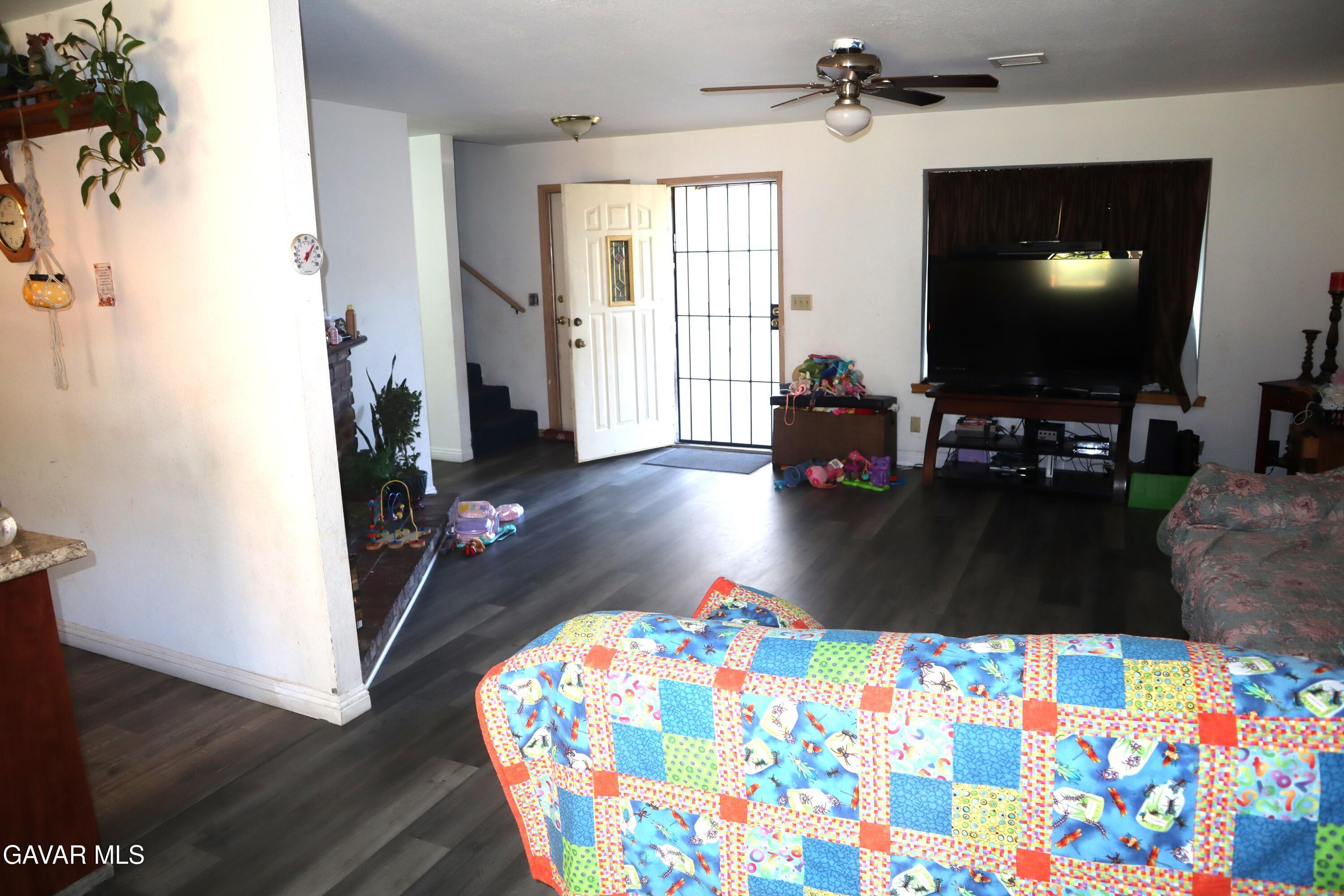 14955 Elizabeth Lake Road Lake Hughes, CA 93532 - Photo 9 of 17 a living room with furniture and a flat screen tv
