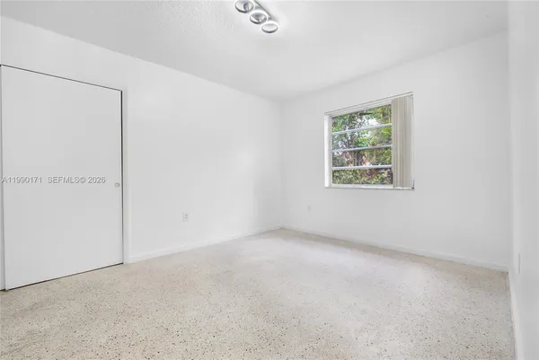 an empty room with windows