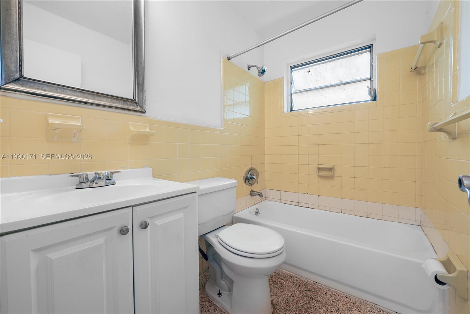 2661 Southwest 11th Street, Unit 8 Miami, FL 33135 - Photo 8 of 9 a bathroom with a sink a toilet and shower