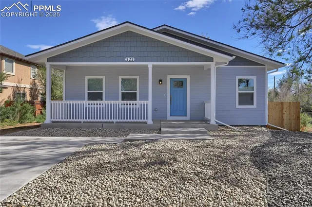 a view of a house with a garden
