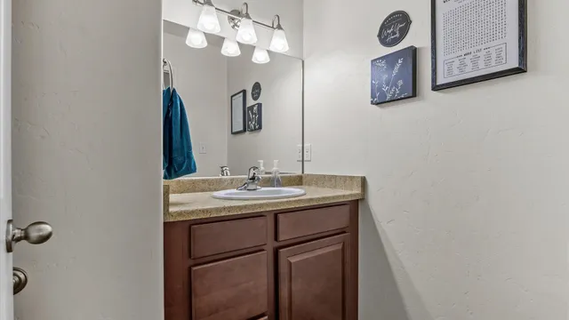 a bathroom with a sink and a mirror