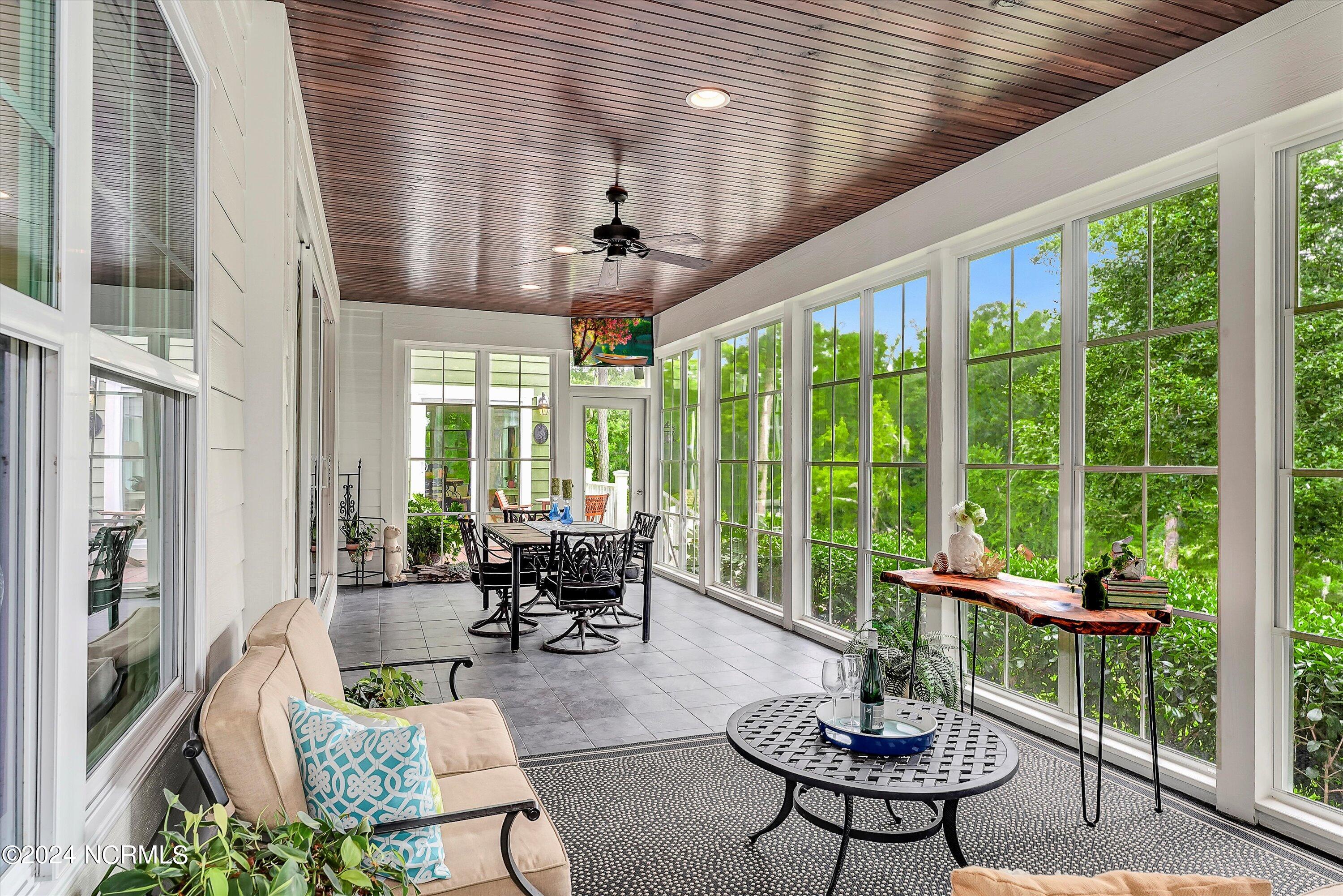 3849 Hallmark Road Northeast Leland, NC 28451 - Photo 8 of 37 Sunroom opens to Great Room, Owners' Suite, and back deck