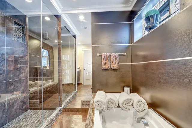 a bathroom with a tub and shower