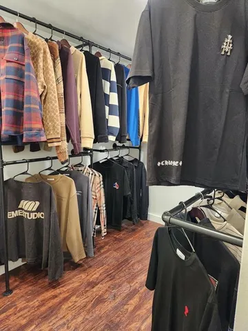 a kitchen with a sink a refrigerator and cabinets