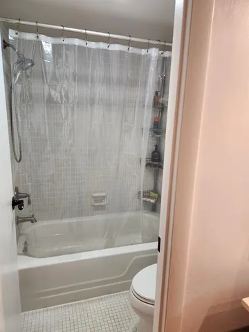 a bedroom with a bed and a closet