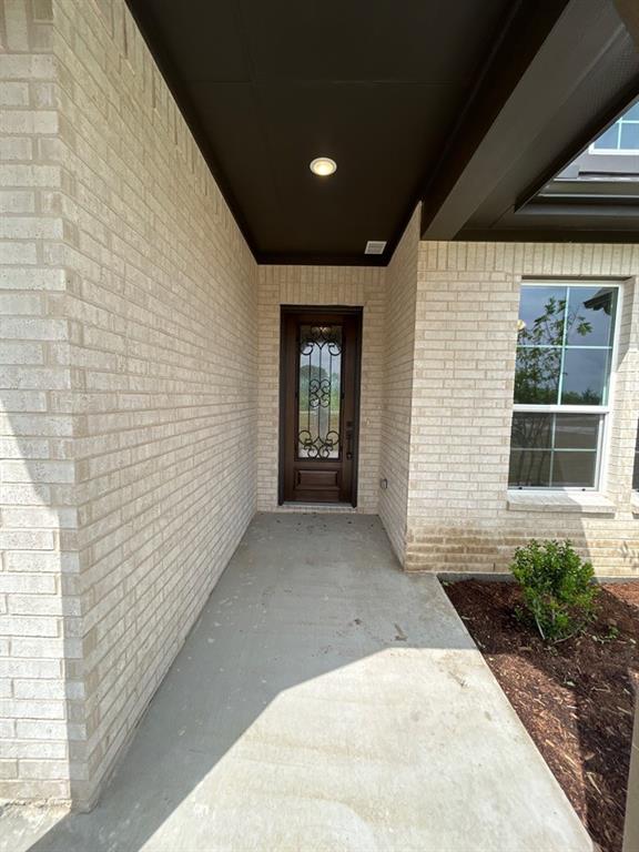 8861 County Road 623 Blue Ridge, TX 75424 - Photo 3 of 20 a view of a house with large windows and a yard