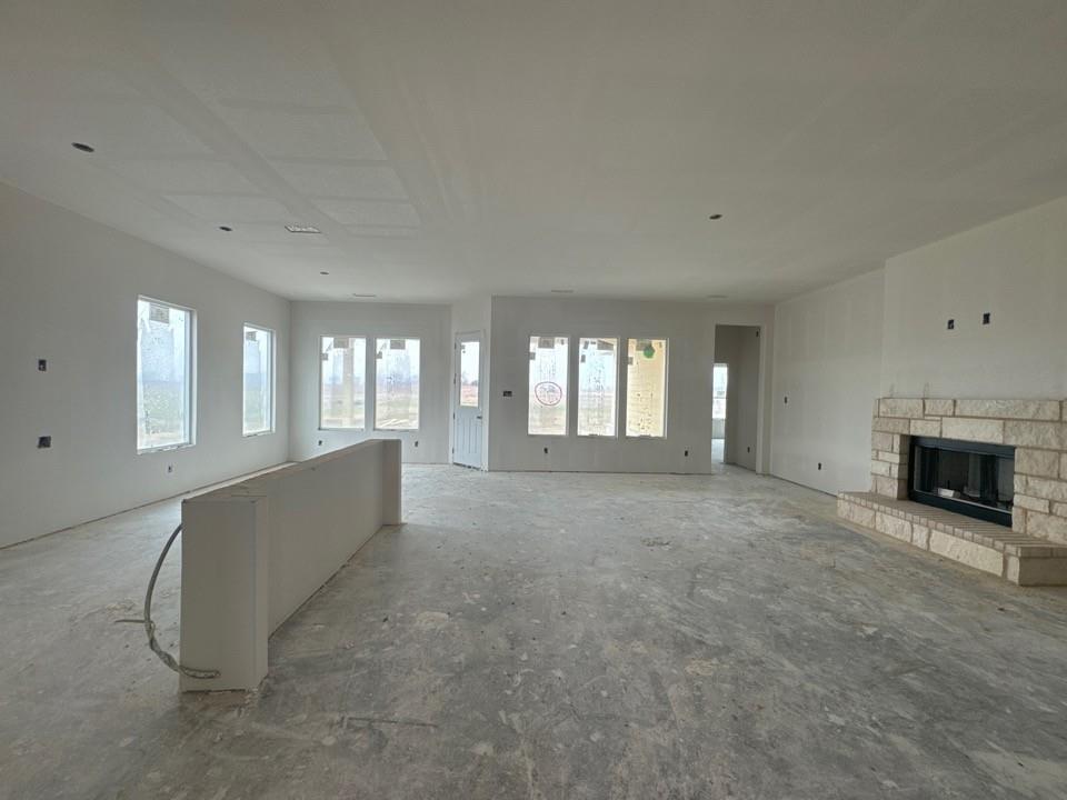 8861 County Road 623 Blue Ridge, TX 75424 - Photo 7 of 17 a view of an empty room with a fireplace and a window
