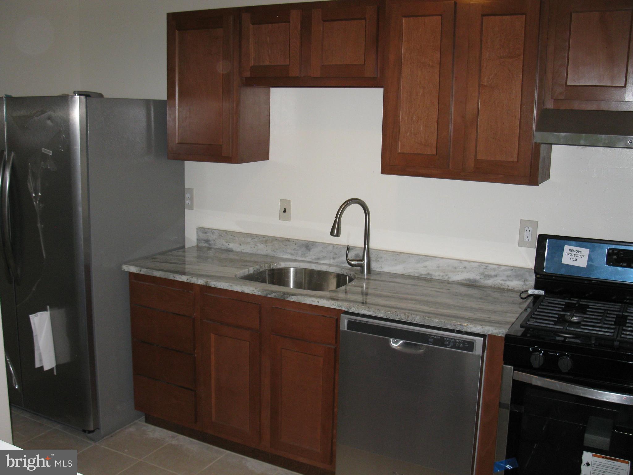 9284 Adelphi Road, Unit 201 Hyattsville, MD 20783 - Photo 1 of 9 Kitchen