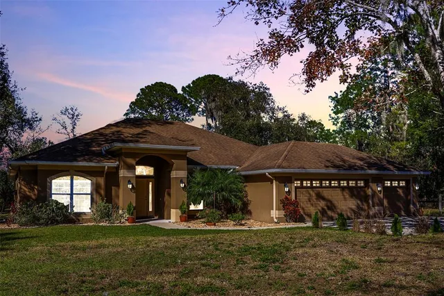 a view of a house with a yard