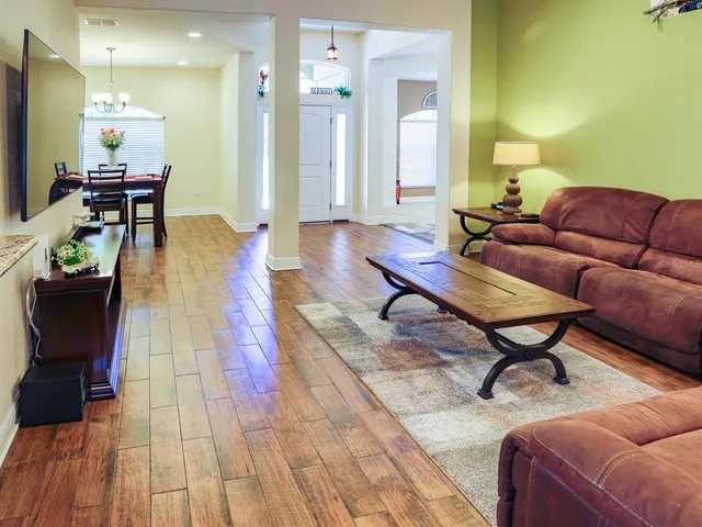 a living room with furniture and a table